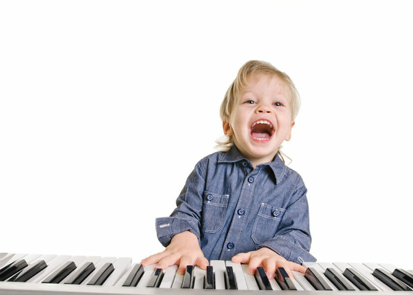 Playing,And,Singing,Little,Boy,On,White,Background